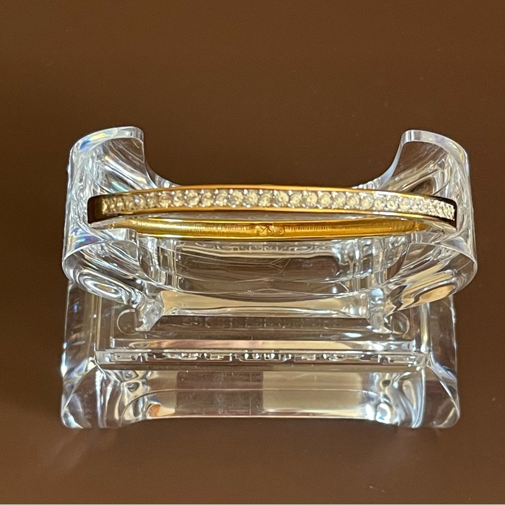 Vintage gold tone Swarovski Crystal hinged bangle.
